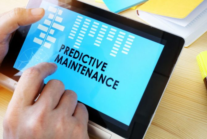 Man holding tablet with title Predictive Maintenance.