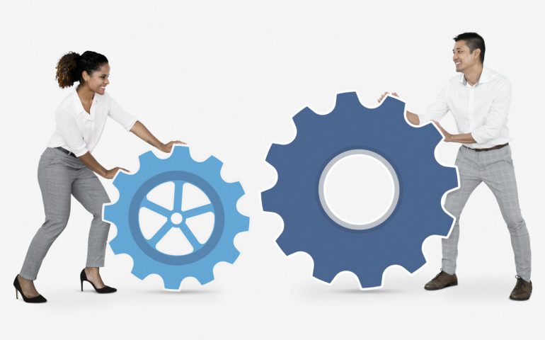 Business people connecting with gears